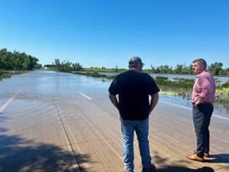 Rep. Finstad meets with Watonwan County Commissioner, Dillon Muheim, to evaluate the deterioration of county and township road conditions in St. James, LaSalle, and Butterfield. Group photo Rep. Finstad attends an emergency city council meeting in Madelia to receive updates on the recent flooding that has overloaded the city's water treatment system. Rep. Finstad meets with Watonwan County Commissioner, Dillon Muheim, to evaluate the deterioration of county and township road conditions in St. James, LaSalle, and Butterfield. Rep. Finstad talks with Jackson mayor, Marcus Polz, and City Councilman Nathan Peterson about the impact of the recent flooding on the city's infrastructure. The Des Moines River is expected to remain in major flood stage for the next several days. 