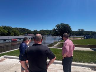 Rep. Finstad talks with Jackson mayor, Marcus Polz, and City Councilman Nathan Peterson about the impact of the recent flooding on the city's infrastructure. The Des Moines River is expected to remain in major flood stage for the next several days. 