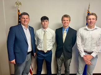 Congressman Finstad with Henry Krebs, Matthew Frentz, and Matthew Larson.